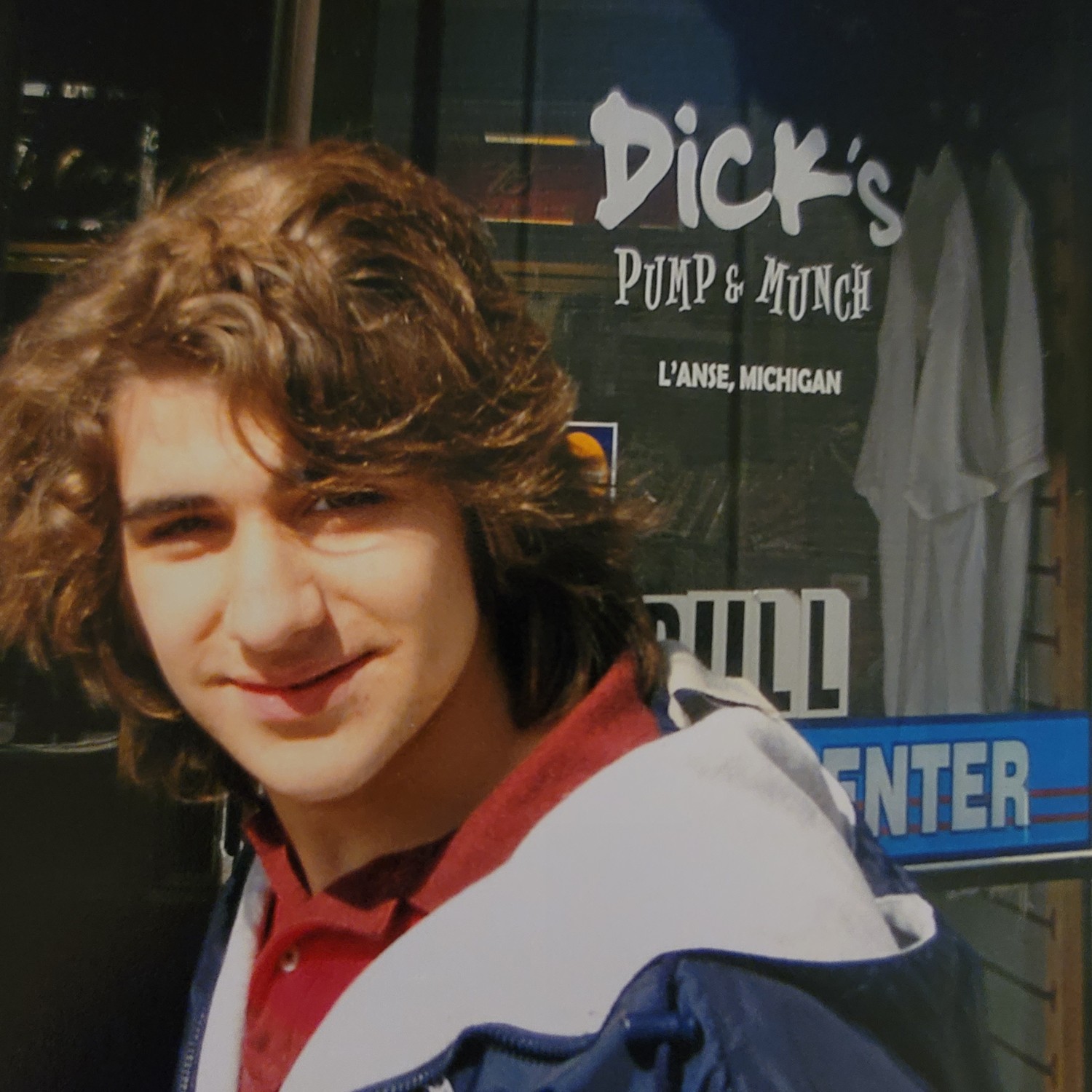 Christopher outside Dick's Pump & Munch in L'Anse, Michigan, on the road to Michigan Tech